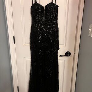 Elegant Black Sequin Gown with slit. Size 2 great condition.